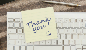 Thank you message on adhesive note on office table